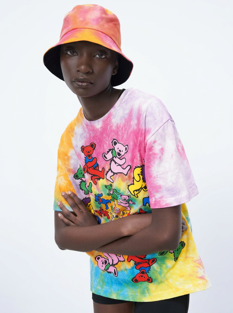 Model in a tie-dye Bizzare Buckade bucket hat and matching dancing-bears tee